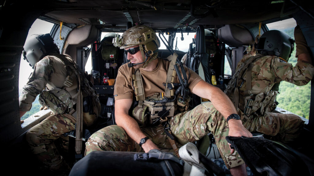 Kentucky Guardsmen search for flood victims below in a UH-60 Black Hawk helicopter in eastern Kentucky.