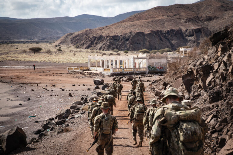 Guard soldiers with Task Force Red Dragon march to the Arta Range complex, Djibouti, for training. The country sits at a maritime chokepoint (below) connecting the Red Sea to the Gulf of Aden and Indian Ocean.